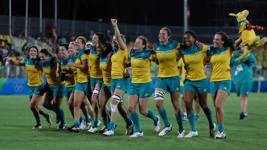 Australia's women's sevens team celebrate their gold medal win at the Rio Olympics