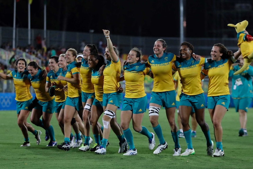 Australia's women's sevens team celebrate their gold medal win at the Rio Olympics