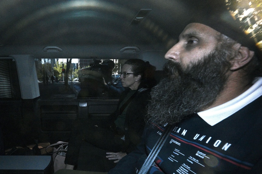 Blurred image of Rajwinder Singh, he man accused of killing Queensland woman Toyah Cordingley, arrives in Melbourne 