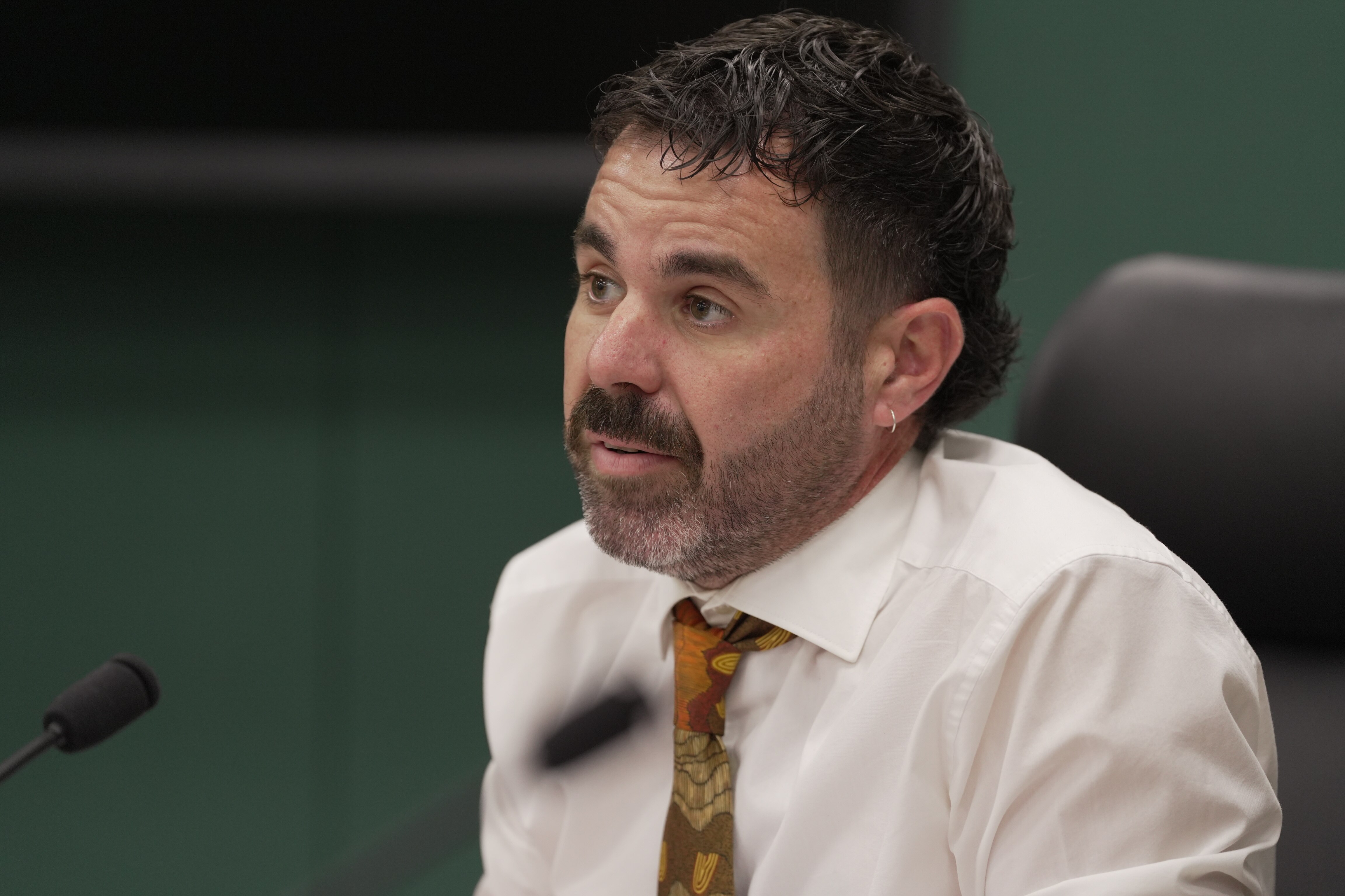 A man in a white shirt and tie