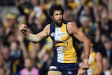 Josh Kennedy celebrates a goal in a packed stadium