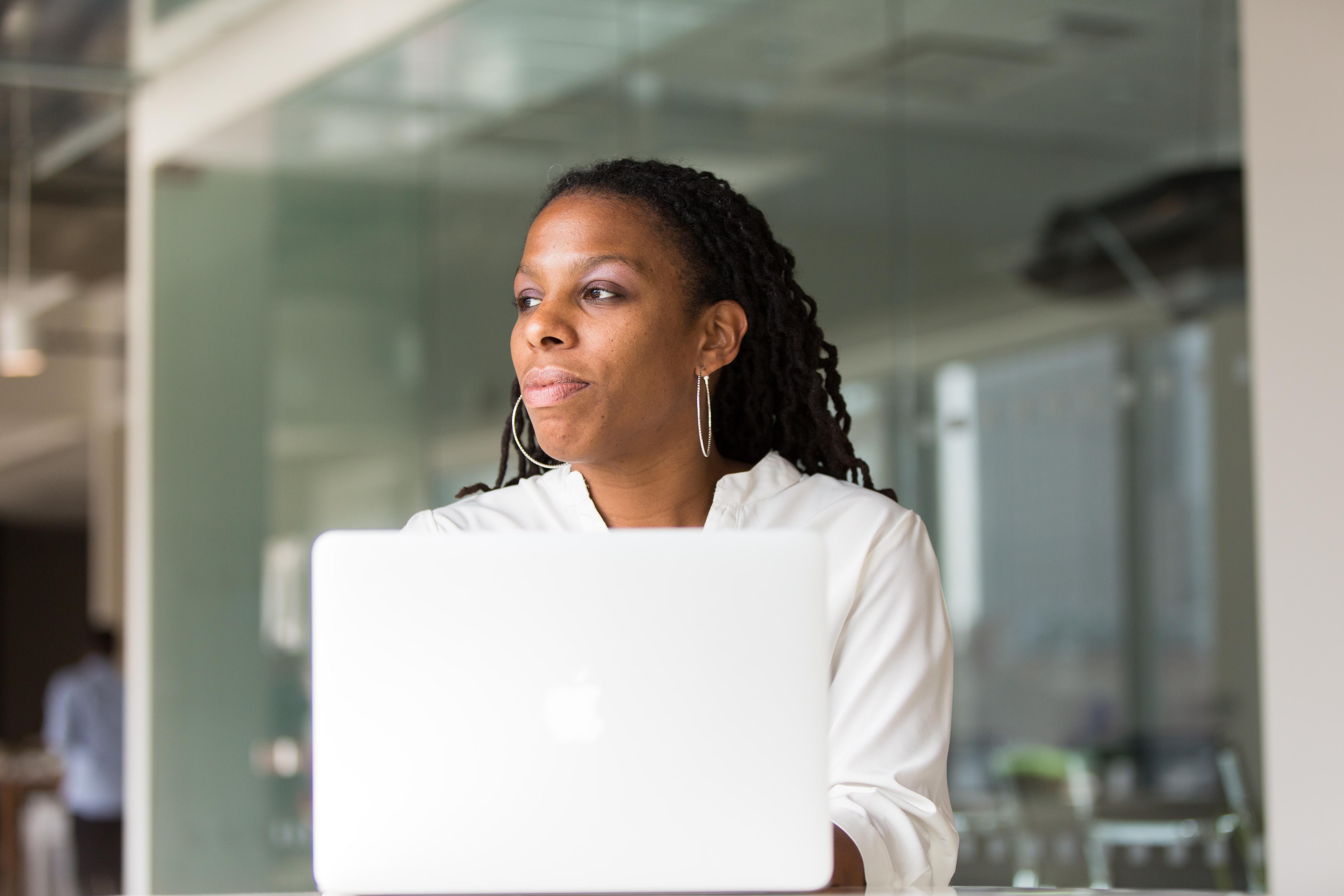 Woman sitting at her laptop in an office.