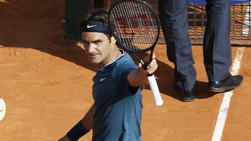 Switzerland's Roger Federer waves to the crowd after beating Serbia's Novak Djokovic at Monte Carlo.
