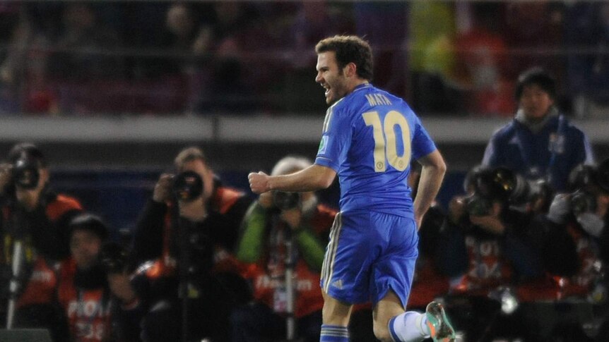 On target ... Juan Mata celebrates his opening goal
