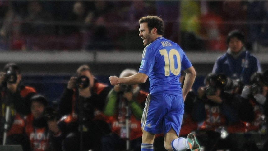 On target ... Juan Mata celebrates his opening goal