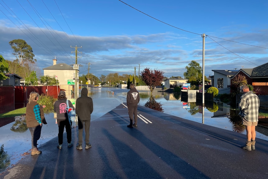 Latrobe residents on the street, assessing the flooding.