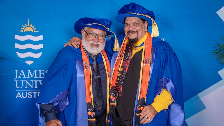 Two men in university regalia.