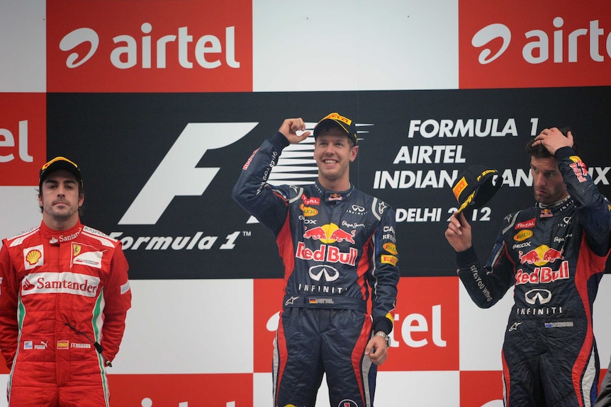 Well on top ... Sebastian Vettel celebrates ahead of Fernando Alonso and Mark Webber