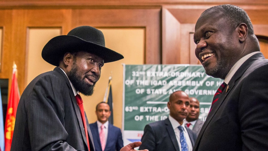 South Sudan's President Salva Kiir and opposition leader Riek Machar shake hands