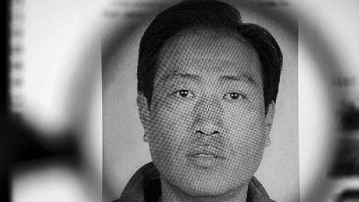 A black and white passport photo shows Gao Chengyong's headshot profile