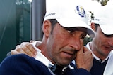 European captain Jose Maria Olazabal (L) with English golfer Justin Rose after Europe won the Ryder Cup.