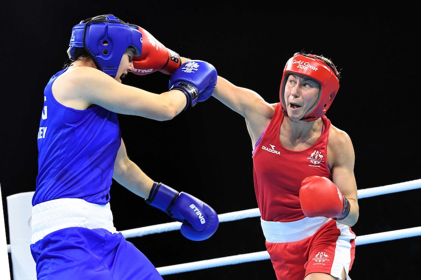 Anja Stridsman of Australia throws a punch at Paige Murney of England