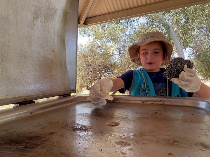 Rory Faria-Preston helping his parents at Palm Valley campground in Finke Gorge National Park
