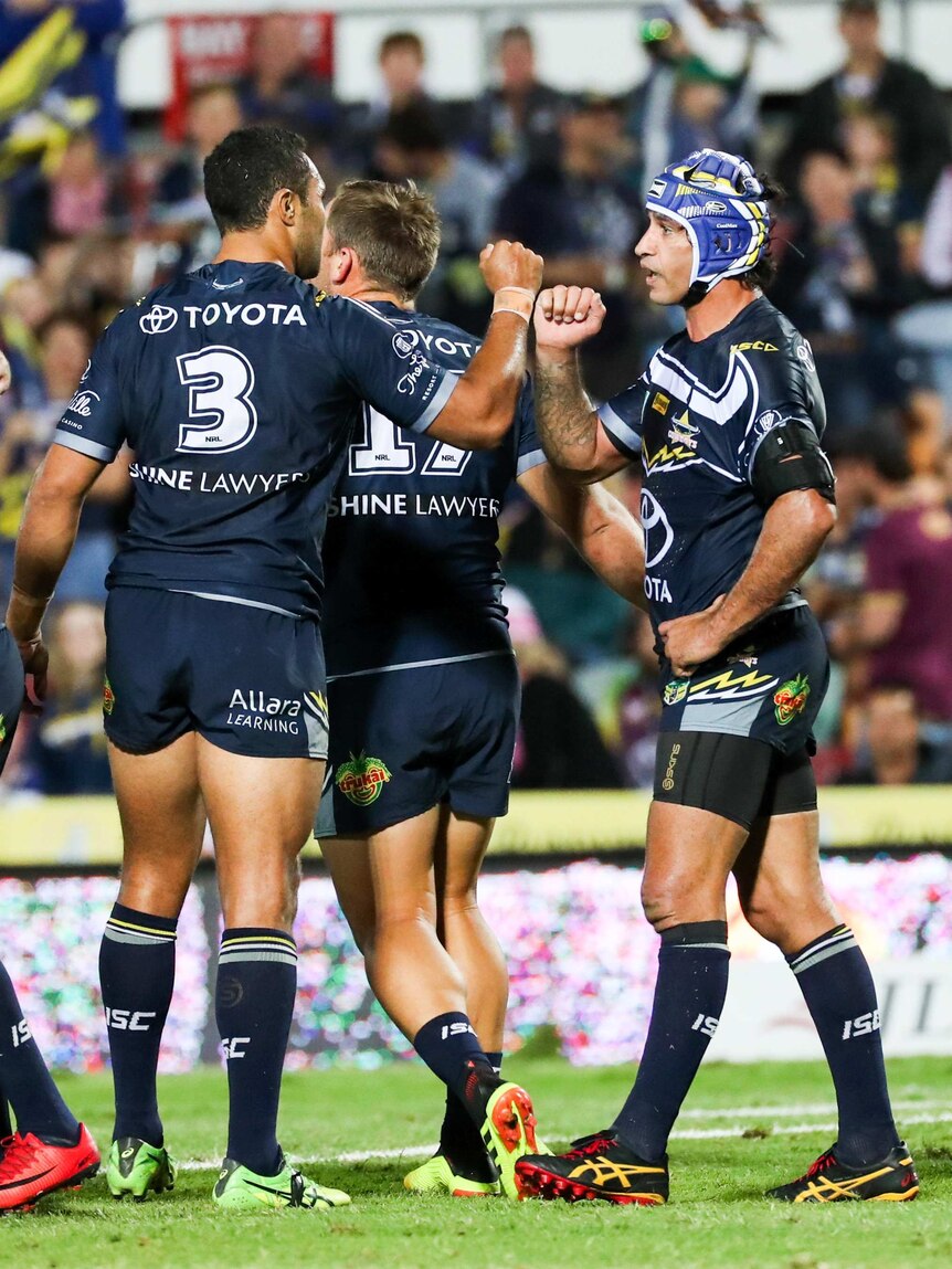Johnathan Thurston and Justin O'Neill celebrate a North Queensland Cowboys try.
