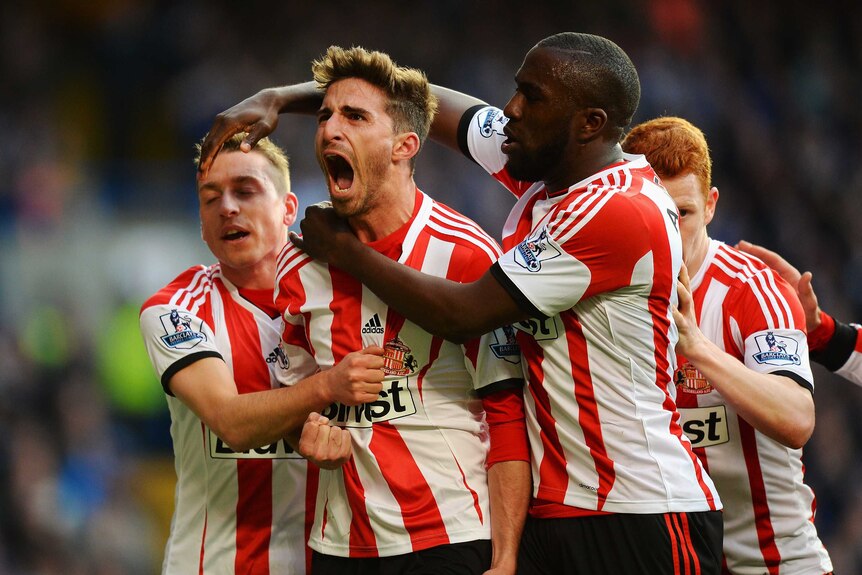 Sunderland's Fabio Borini (C) celebrates with team-mates after his goal against Chelsea.
