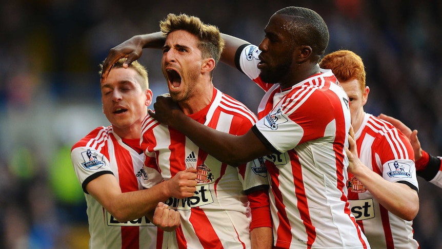 Sunderland's Fabio Borini (C) celebrates with team-mates after his goal against Chelsea.