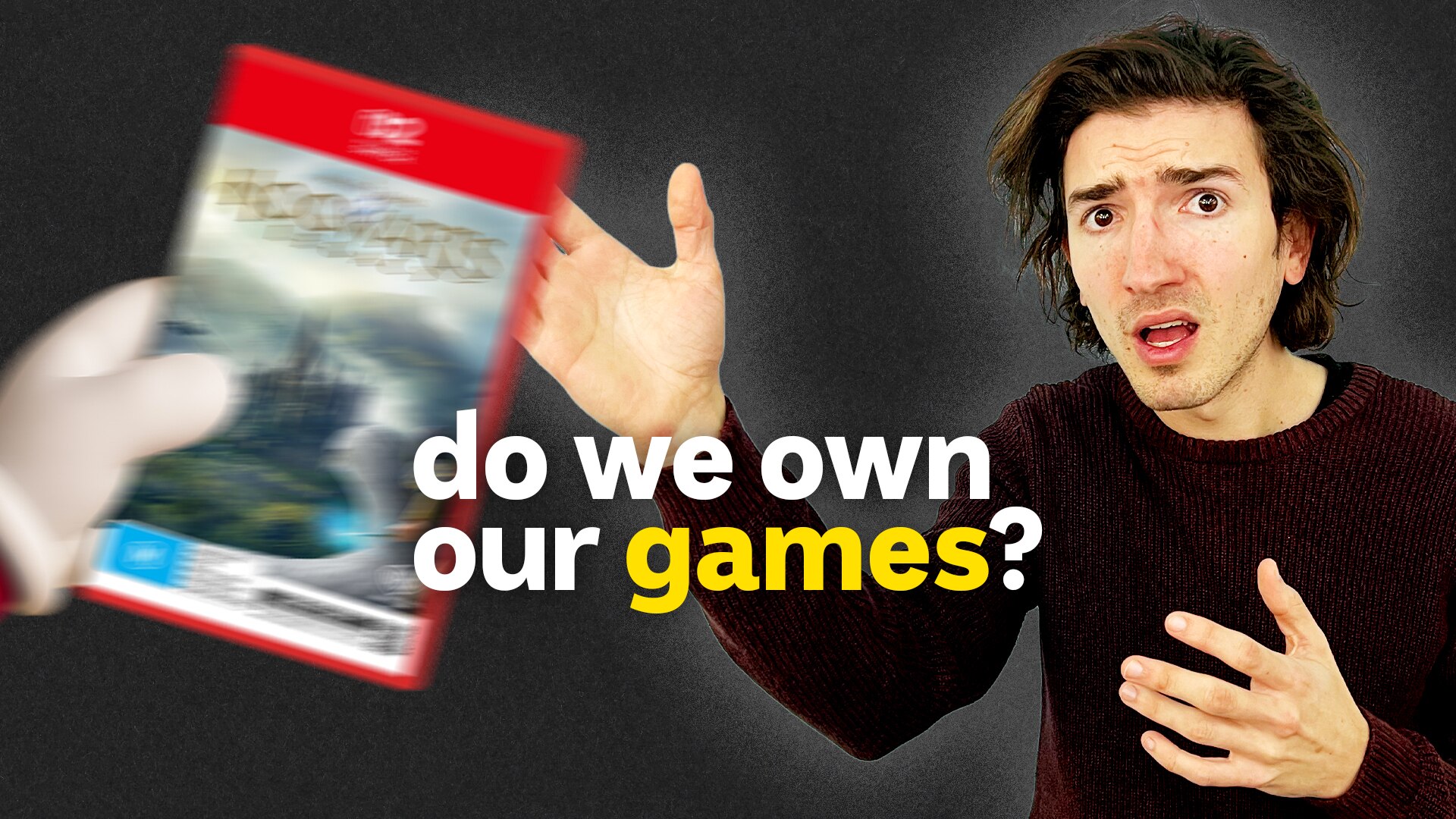 Thomas looks annoyed as he has a DVD taken out of his hands.