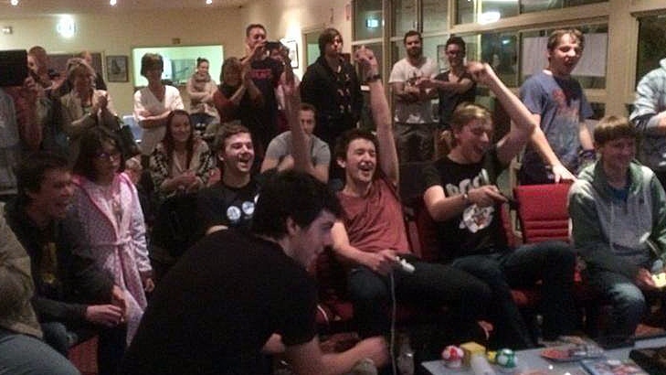 Harry Twyford, Matt Smith, James Hickman, Josh Alexander celebrate their Mario Kart record (centre) with friends.