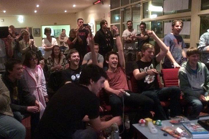 Harry Twyford, Matt Smith, James Hickman, Josh Alexander celebrate their Mario Kart record (centre) with friends.