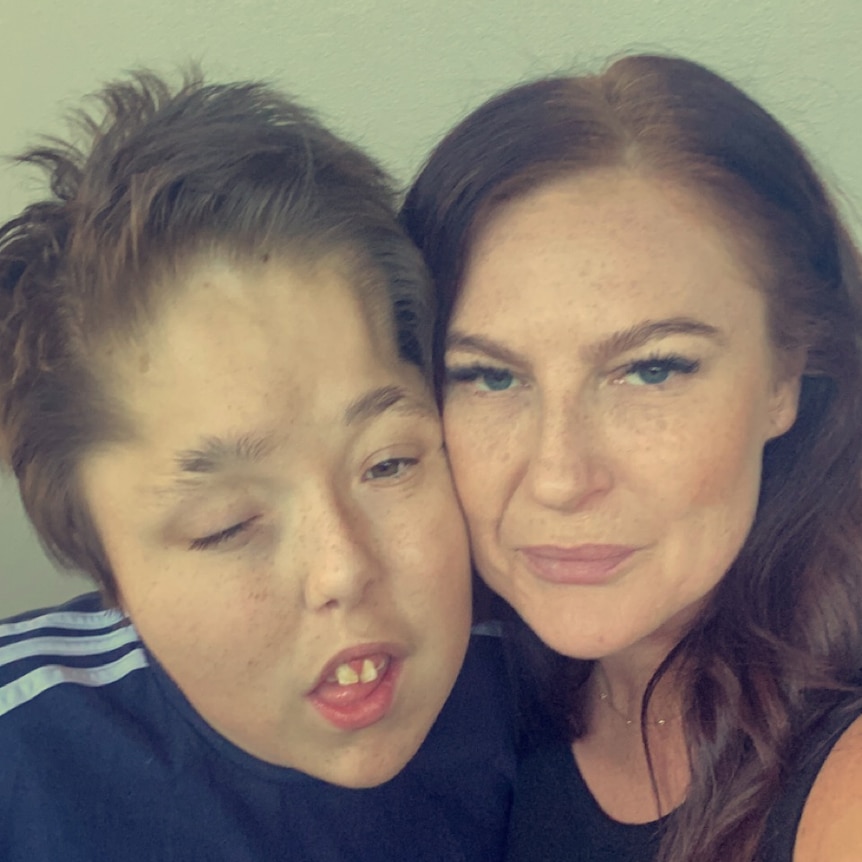 A boy with autism and a middle-aged woman