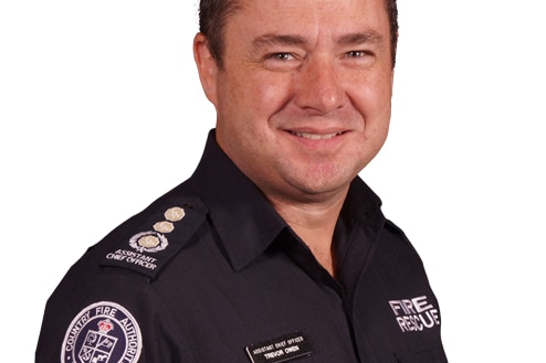 A man with short brown hair wears a blue Country Fire Authority uniform