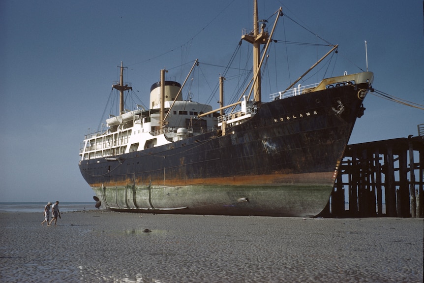 State Ship MV Koolama stuck in the mud at Broome Jetty in 1962