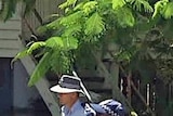 Police make their way through floodwaters