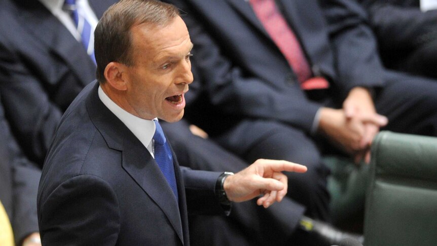 Tony Abbott delivers the budget reply. (AAP: Alan Porritt)