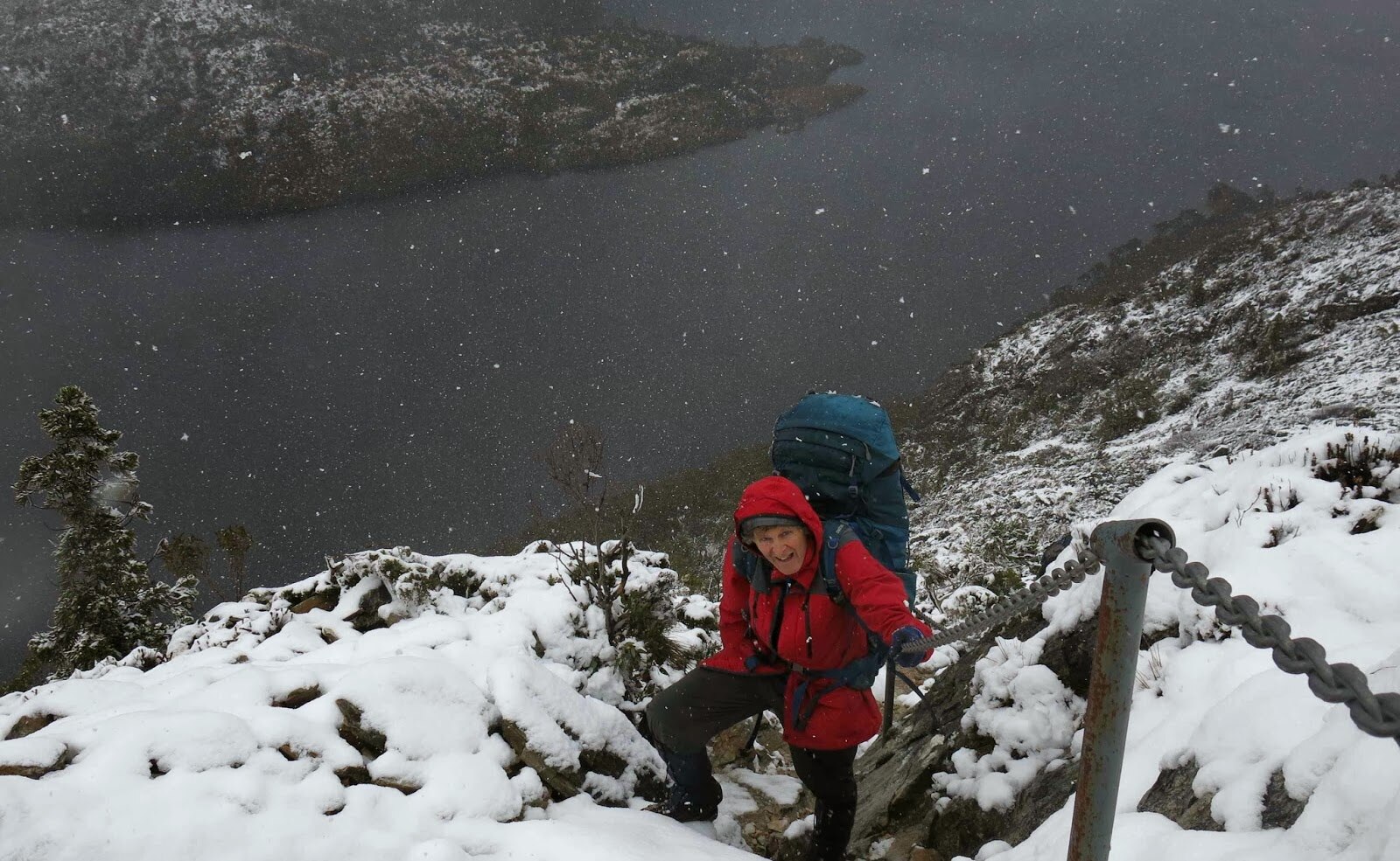 a man in walking gear in thick snow