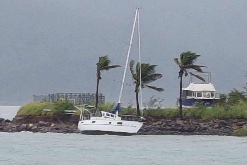 The yacht 'Sail Away' comes adrift in Shute Harbour in the Whitsundays as the effects of Cyclone Iris are felt
