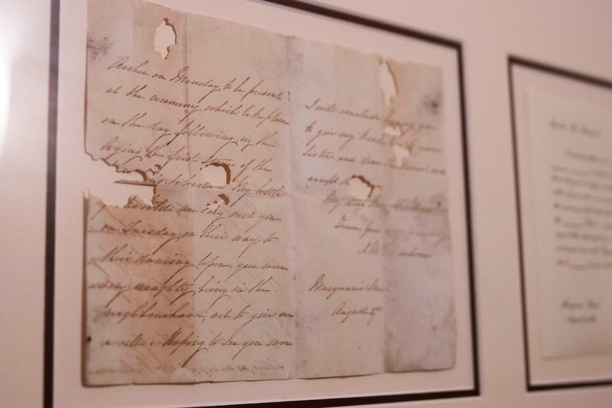 An old letter, framed and on display.