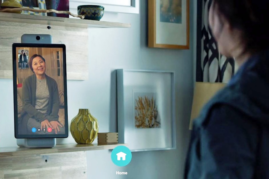 A woman speaks to another woman on a voice call using the Facebook Portal smart speaker.