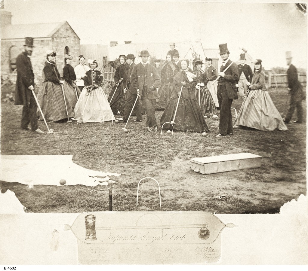 Black and white photograph from 1868 showing men and women in period dress playing croquet in regional SA