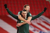 Gareth Bale and Harry Kane celebrate scoring a goal.