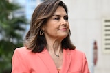 Lisa Wilkinson in a coral suit.