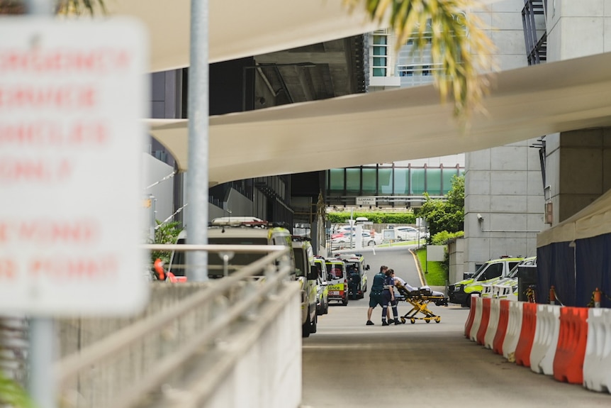 Person wheeled on stretcher into Brisbane hospital