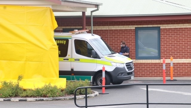 North West Regional Hospital ambulance and paramedic in mask, Burnie, Tasmania, April 2020