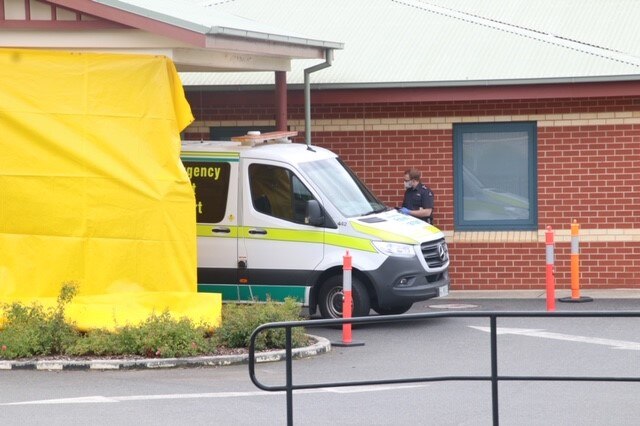 North West Regional Hospital ambulance and paramedic in mask, Burnie, Tasmania, April 2020