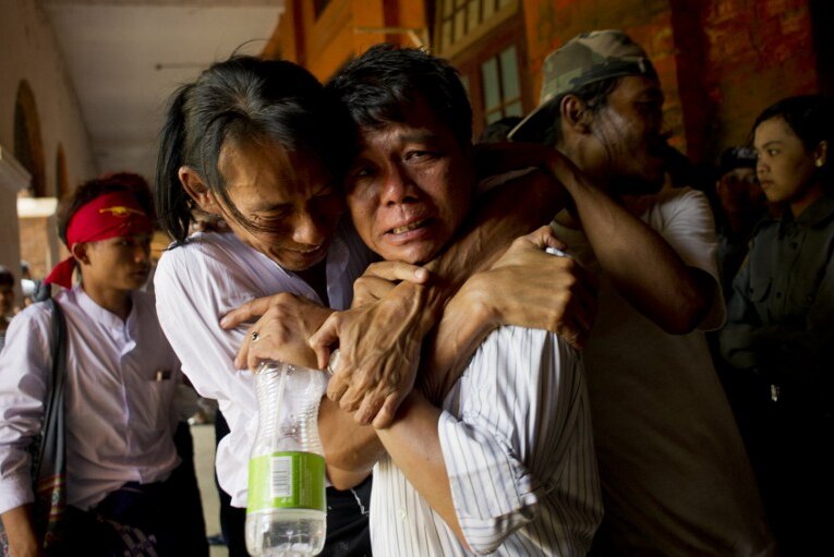 Newly-released political student protester and family members embrace and cry after being reunited