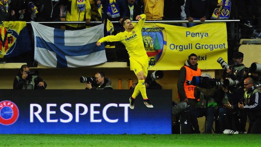 Denis Suarez celebrates Adrian Lopez's goal for Villarreal against Liverpool in Europa League.