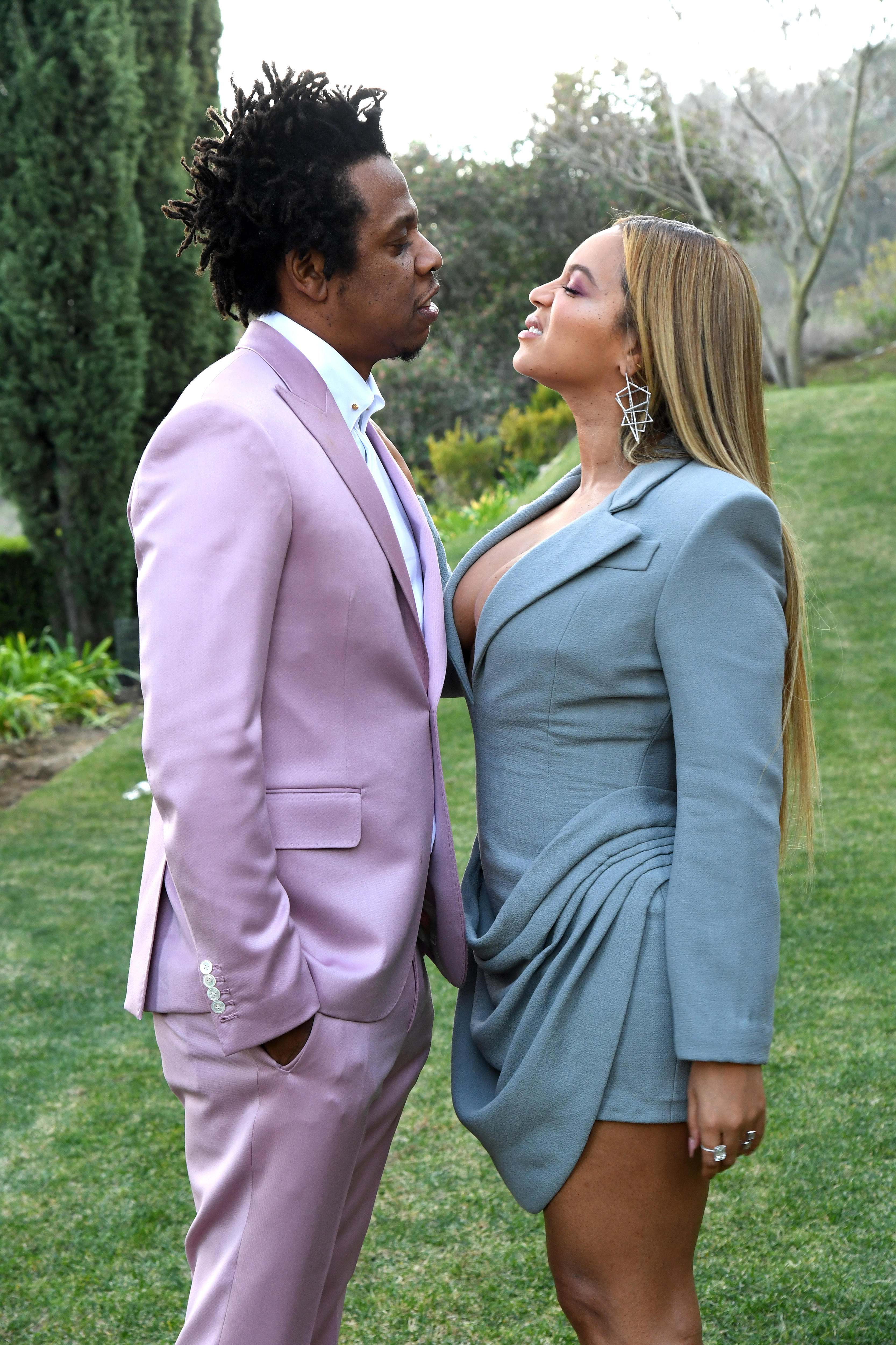 beyonce and j z pose for a photo looking directly at each other