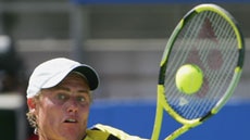 Lleyton Hewitt attempts to hit a backhand during his three-set win over Vince Spadea