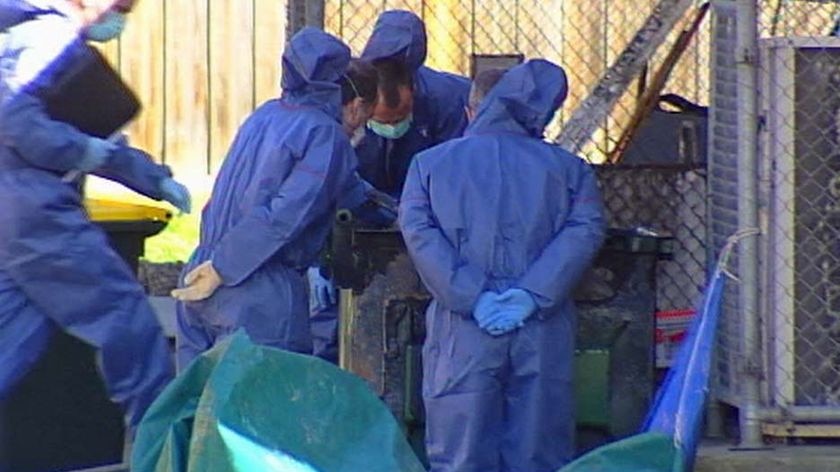 Forensic police searched for evidence following the grisly discovery.
