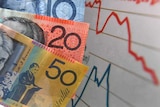 Australian currency is seen next to a wages graph