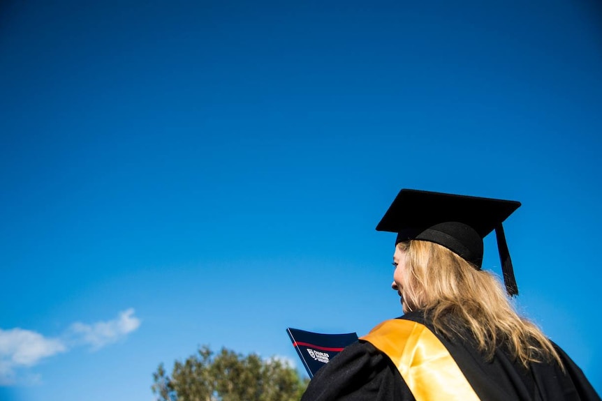 A student at Charles Darwin University heads to a 2016 graduation ceremony.