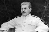 Former Russian leader Josef Stalin sits in a chair