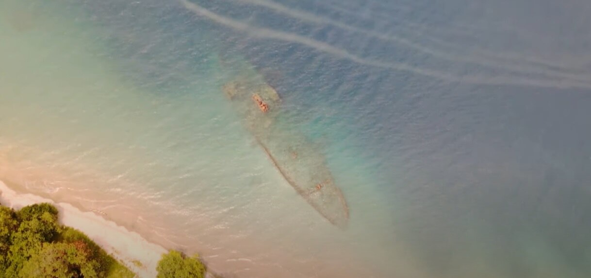 A shipwreck underwater shot from above, very close to the shoreline in Solomon Islands.