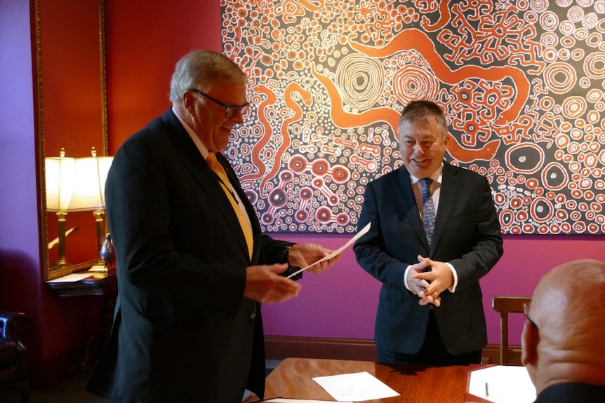 Sofronof and Kim Beazley shake hands during the judge's swearing in in WA