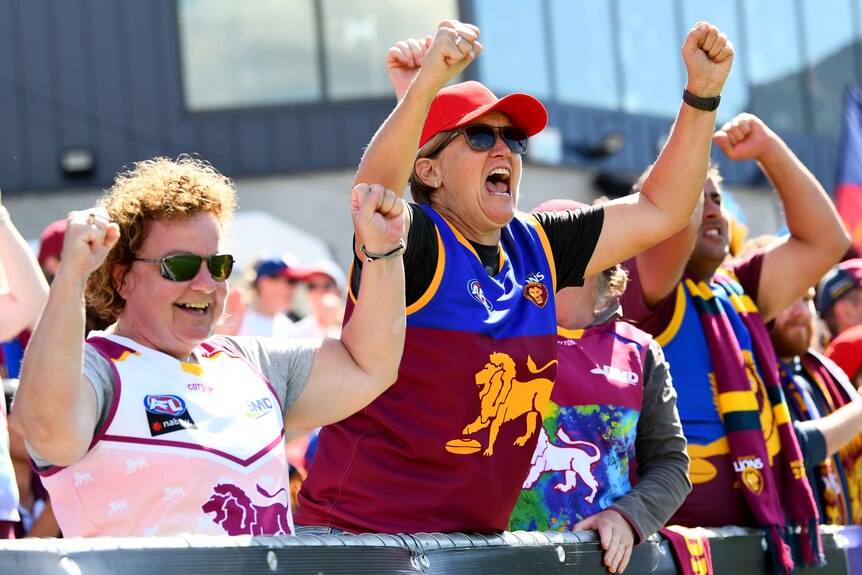 Brisbane Lions fans celebrate their team's AFLW grand final win