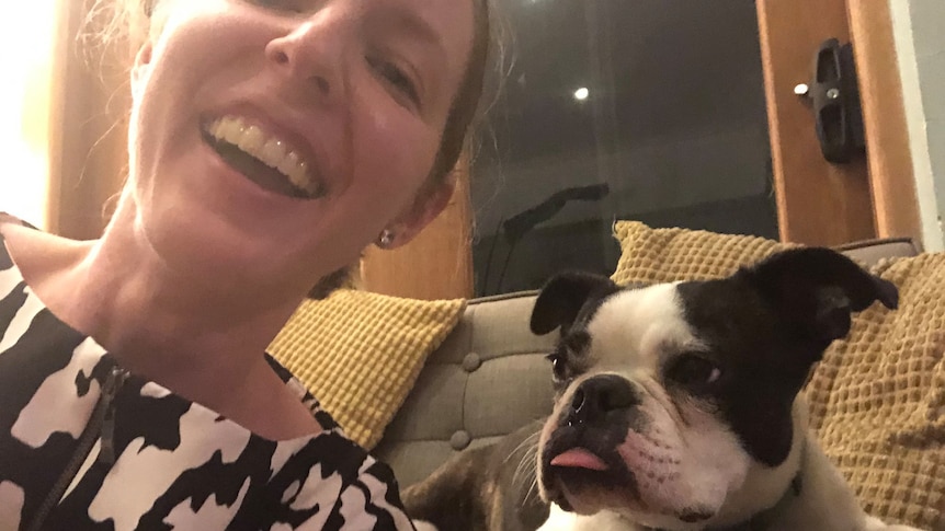 Kate Smith pictured smiling with a dog she looked after while pet sitting.